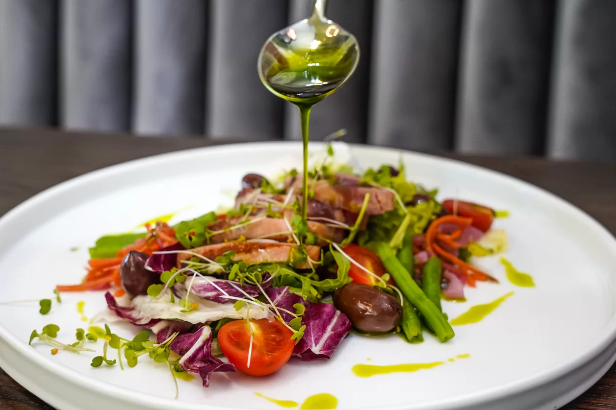 A fancy fresh salad draped with olive oil, a Croatian delicacy
